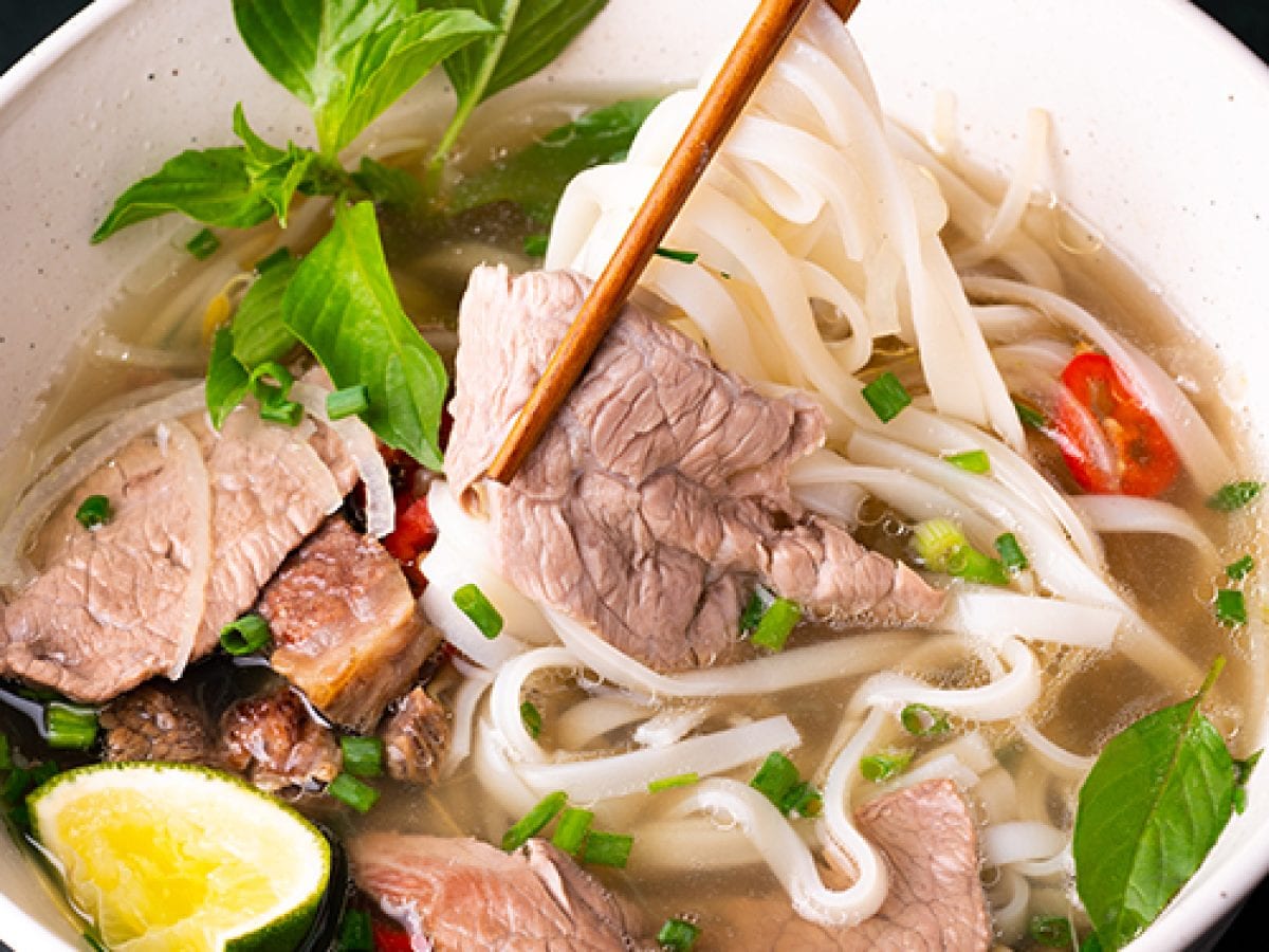 Pho is a traditional Vietnamese noodle soup with beef or chicken and flat rice noodles